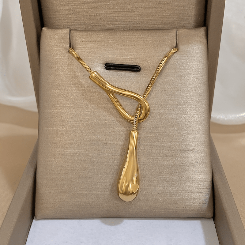 Vintage white gold necklace with a teardrop pendant