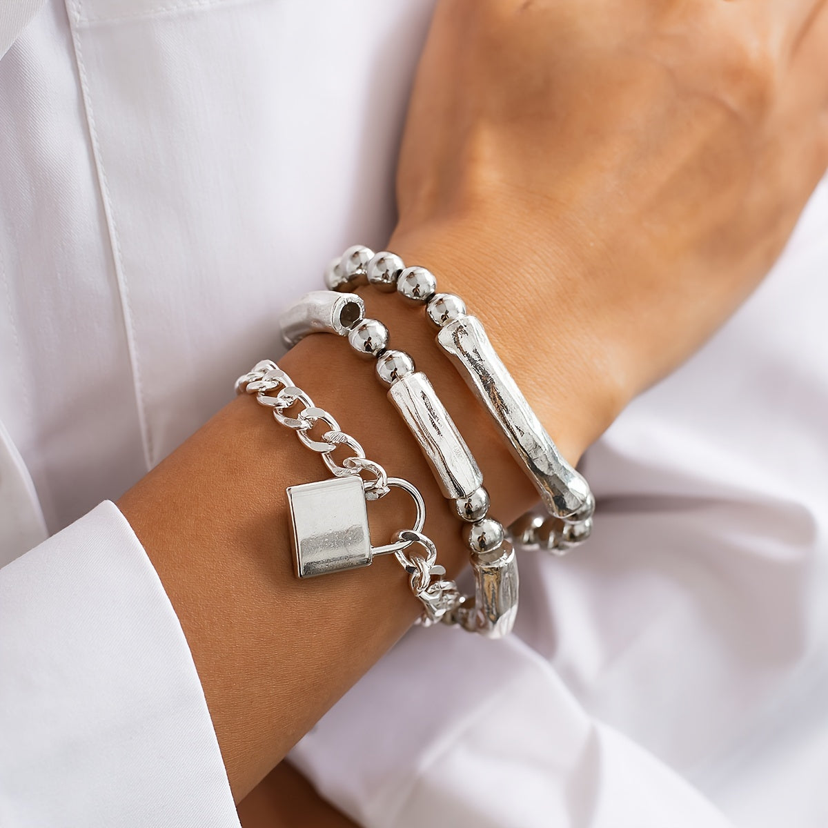 Collection of White Gold Pearl Bracelets with Punk-Style Clasps