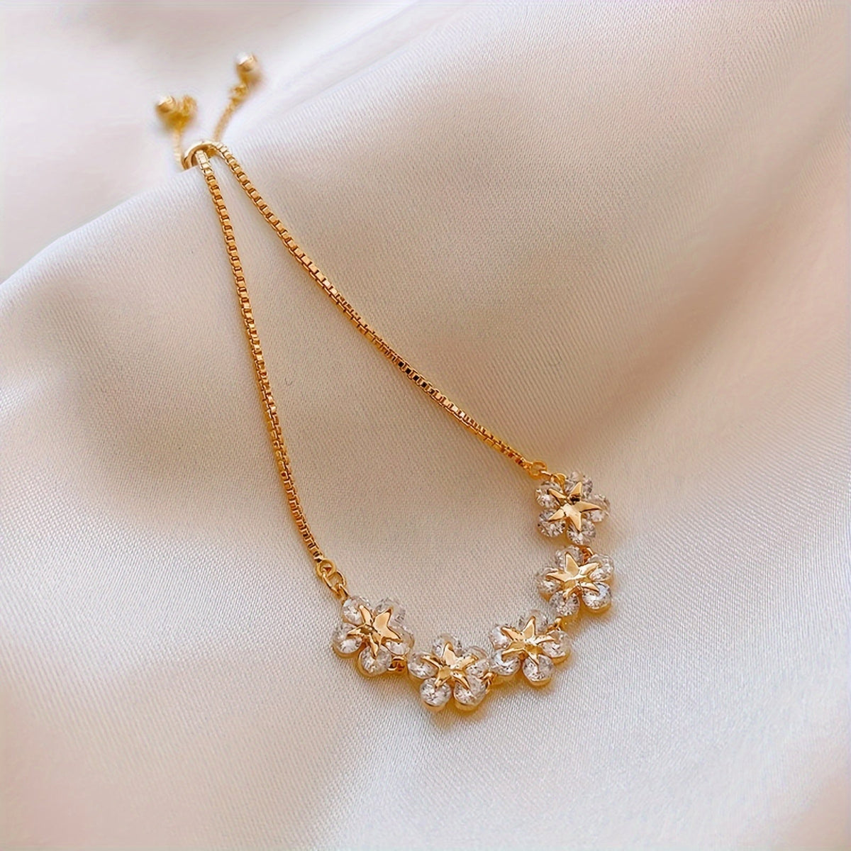White Gold Bracelet with Flower-Shaped Cubic Zirconia