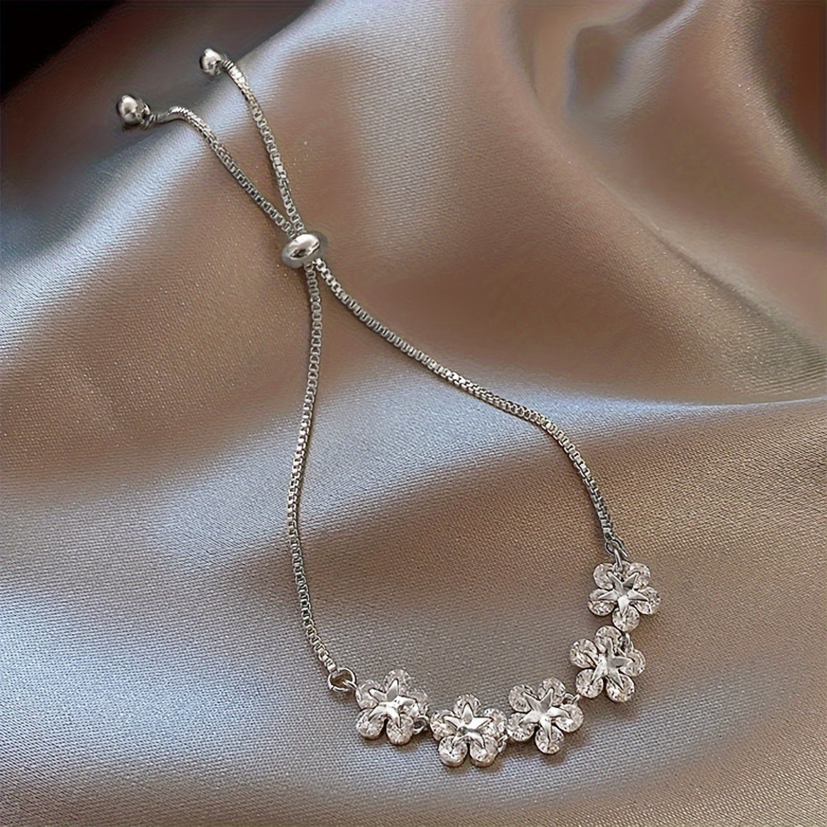White Gold Bracelet with Flower-Shaped Cubic Zirconia
