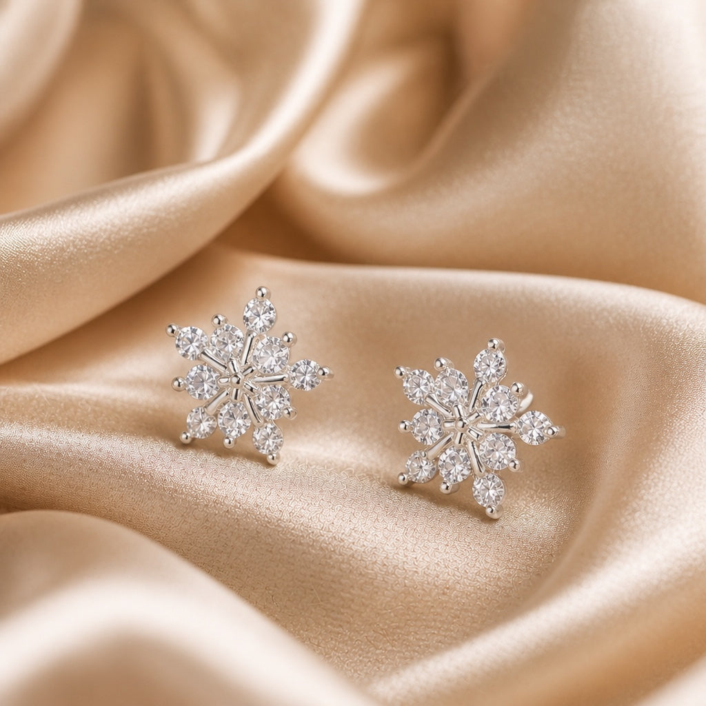 White gold snowflake-shaped earrings