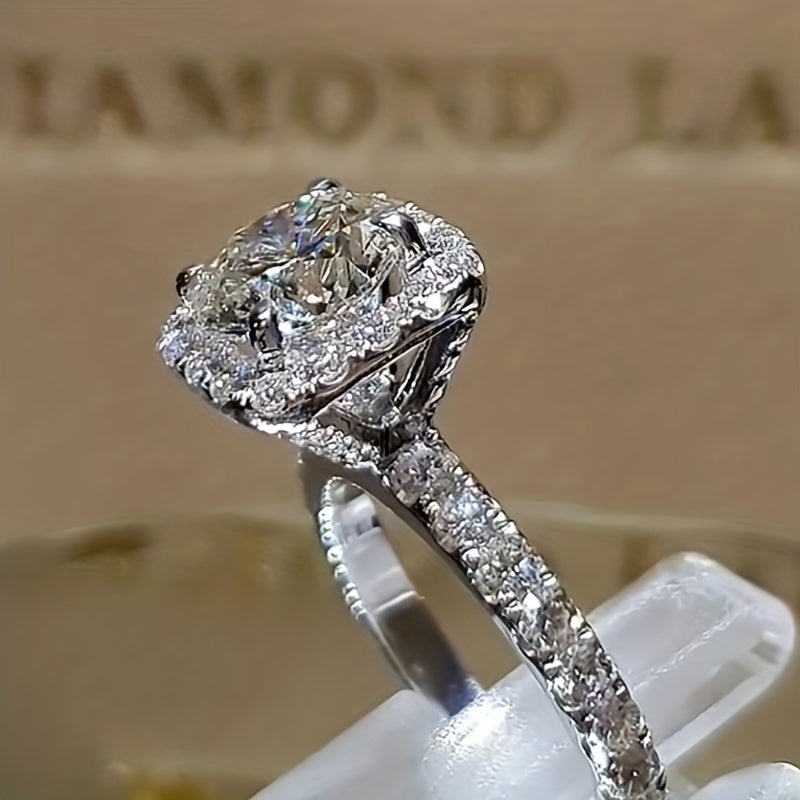 White gold ring with a set zirconia stone