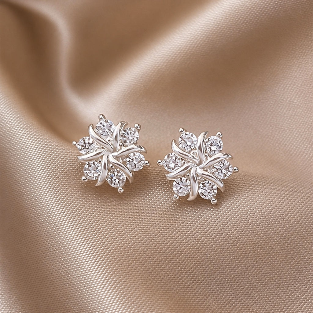 White gold snowflake-shaped earrings