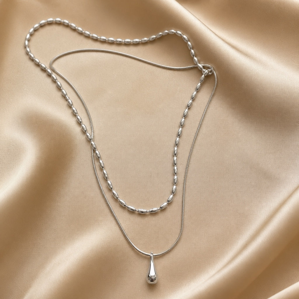 Double-layer white gold necklace with a teardrop pendant
