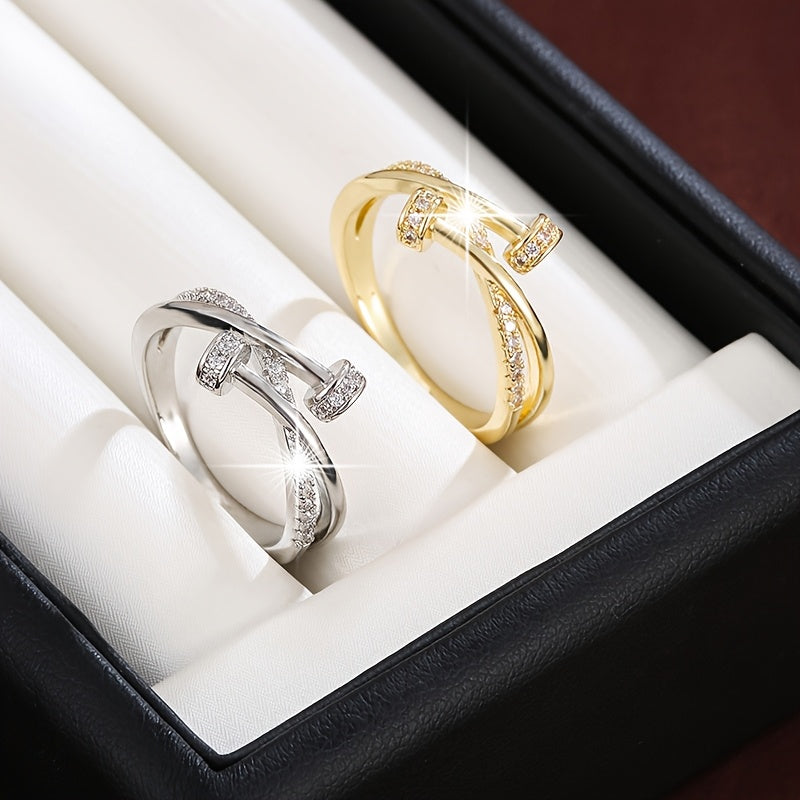 White gold crossover ring with cubic zirconia