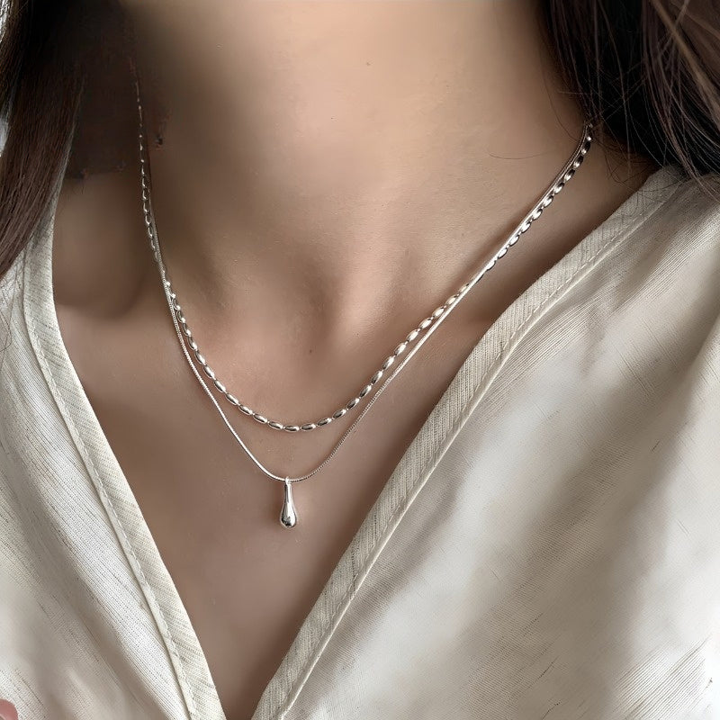 Double-layer white gold necklace with a teardrop pendant