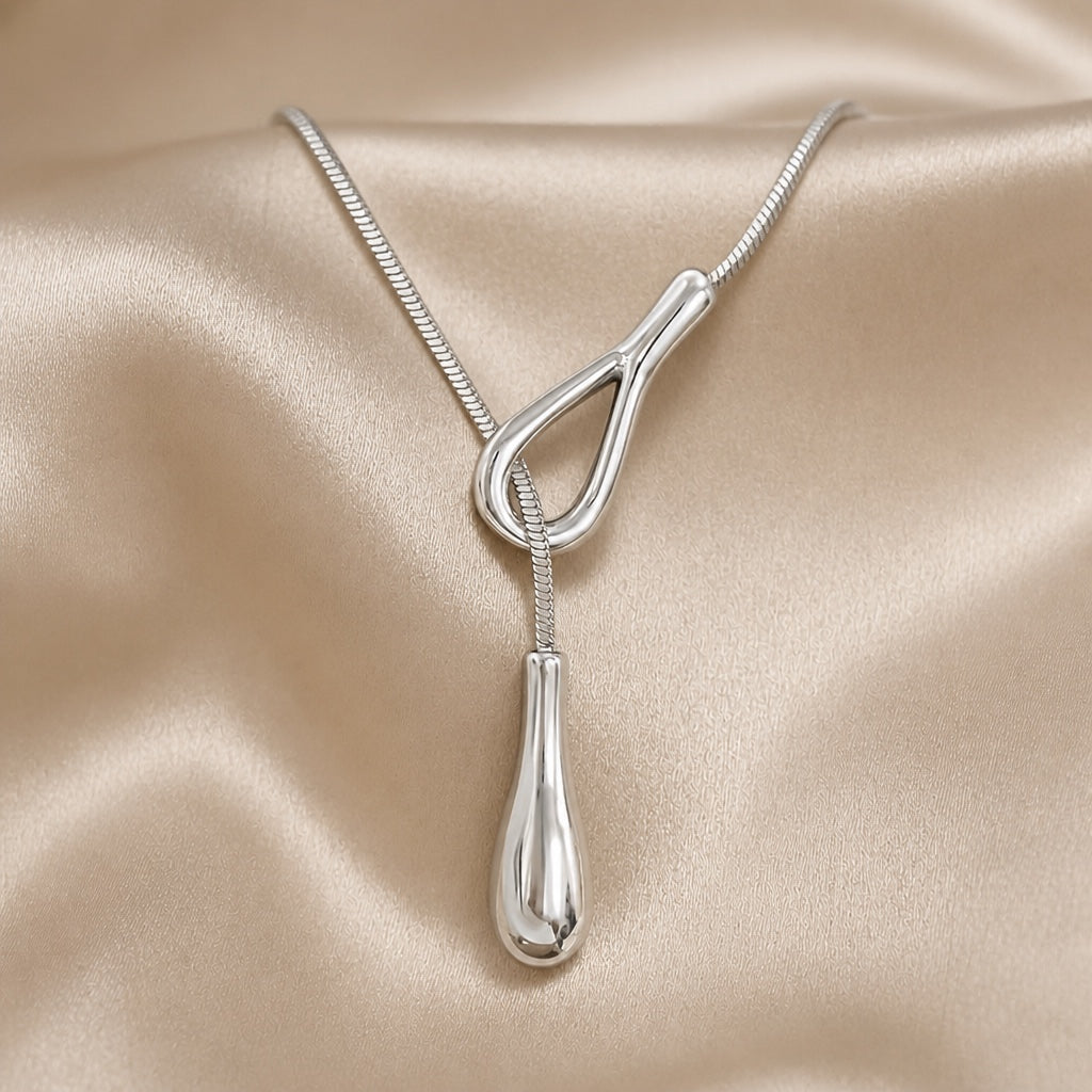 Vintage white gold necklace with a teardrop pendant
